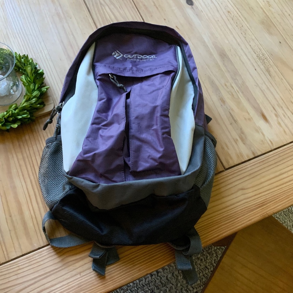 OUTDOOR PRODUCTS  Plum colored backpack$25